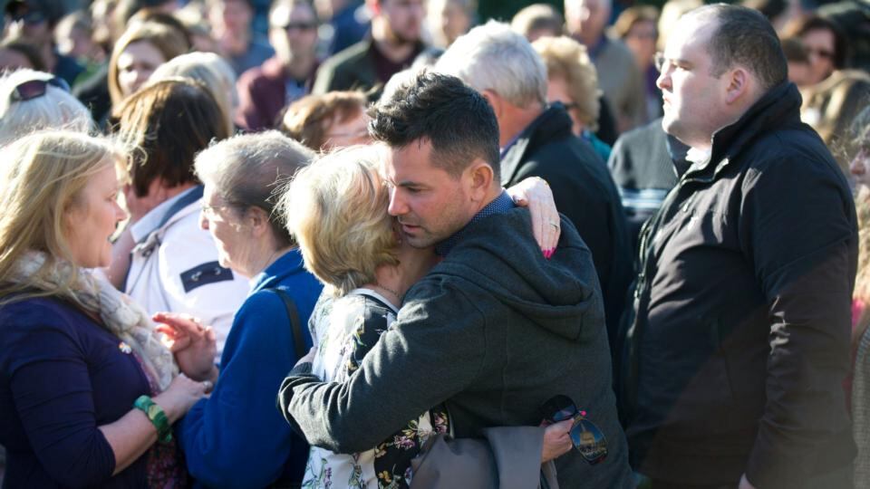 Kieran Buckley (centre), a brother of Karen Buckley, is comforted as he joins hundreds of mourners at a vigil for his sister in George Square, Glasgow. Photograph: Jane Barlow/PA Wire.