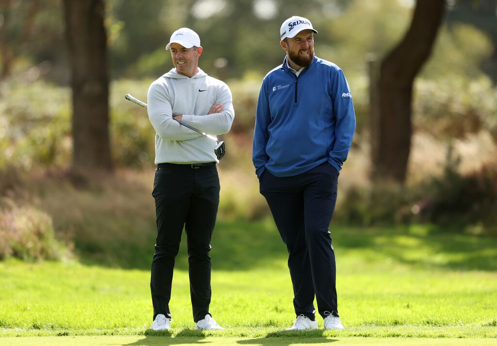 Rory McIlroy of Northern Ireland and Shane Lowry of Ireland talk on the ninth hole at Wentworth. Photograph: Kate McShane/Getty