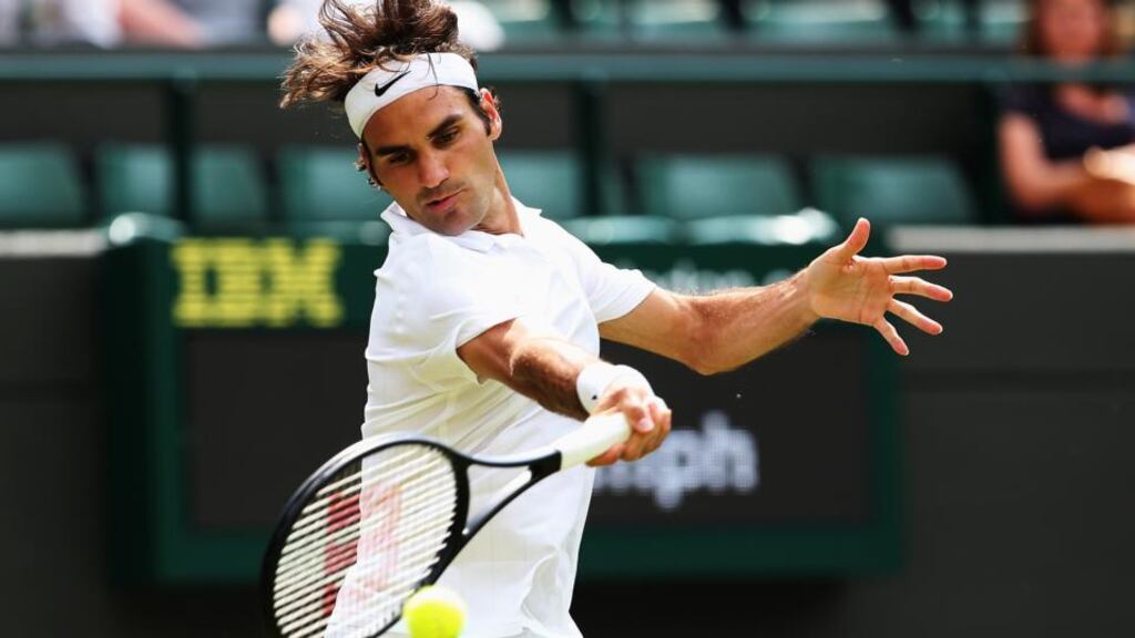 Roger Federer on his way to reaching the second round at the All England Club with a straight sets win over Italian Paolo Lorenzi on Court One. Photograph: Jan Kruger/Getty Images