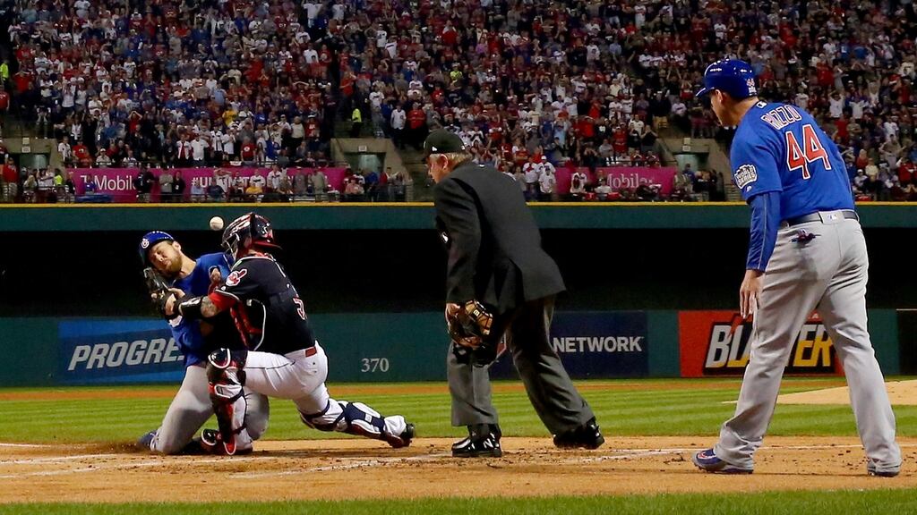 Ben Zobrist  of the Chicago Cubs crashes into Roberto Perez  of the Cleveland Indians to score a run in the first inning of  Game Six of the World Series at Progressive Field  in Cleveland, Ohio. Photograph: Elsa/Getty Images