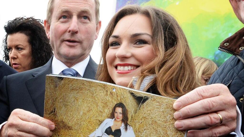 Taoiseach Enda Kenny with newsreader Marita Kelly, from Cappoquin, Co Waterford, whose photograph appears in the Macra na Feirme ‘Cheeky’ charity calendar. Photograph: Eric Luke