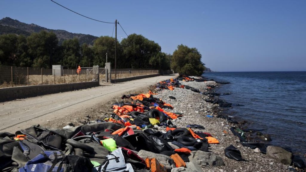 Life jackets, deflated dinghies and life tubes are left behind by refugees and migrants on a beach on the Greek island of Lesbos, on Friday. REUTERS/Dimitris Michalakis