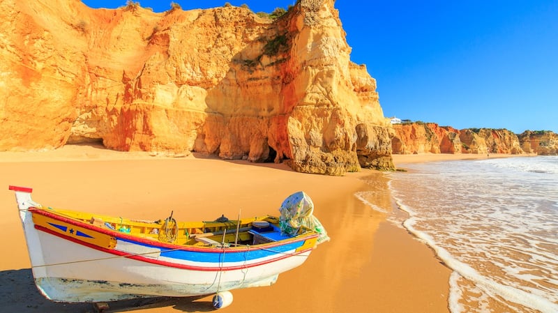 Head to  Praia da Rocha in Portimao, Portugal for some winter sun