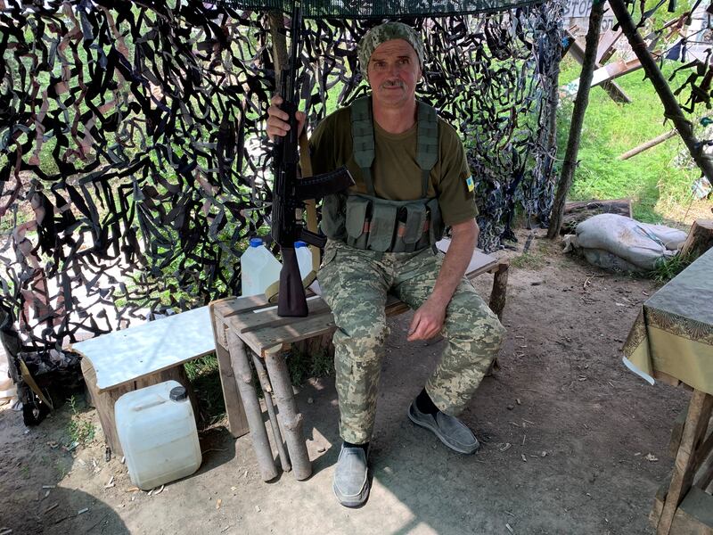 Svyatoslav Shcherbyna “got goosebumps” when he learned he was descended from Cossacks. Shcherbyna mans a checkpoint as a community volunteer. Photograph: Lara Marlowe