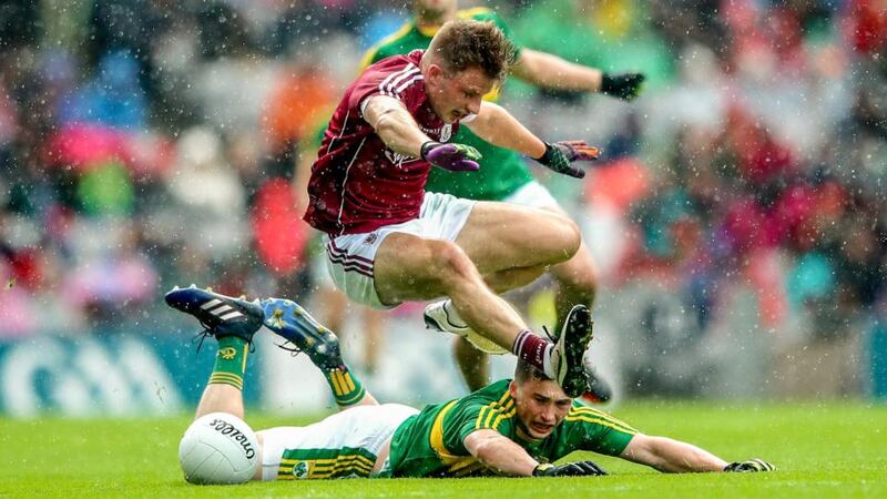 Galway’s Eoghan Kerin jumps over Paul Murphy of Kerry. Photo: James Crombie/Inpho