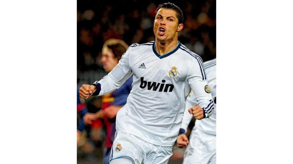 Cristiano Ronaldo celebrates after scoring from the penalty spot against Barcelona last night