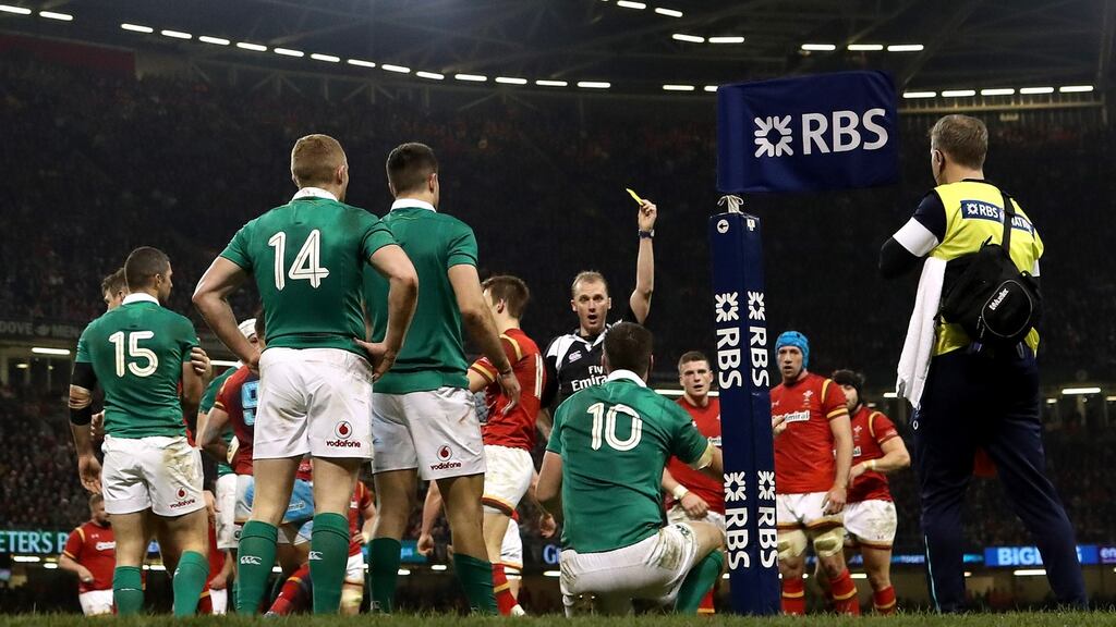 Ireland’s Jonathan Sexton is yellow-carded by referee Wayne Barnes at the Principality Stadium in Cardiff, Wales. Photograph: James Crombie/Inpho