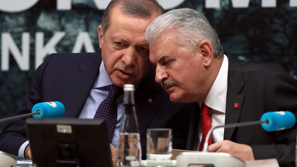 President of Turkey Recep Tayyip Erdogan and Turkish Prime Minister Binali Yildirim speak as they attend the Turkish Union of Chambers and Commodity Exchanges Economic Council in Ankara. Photograph: Adem Altan/AFP/Getty Images