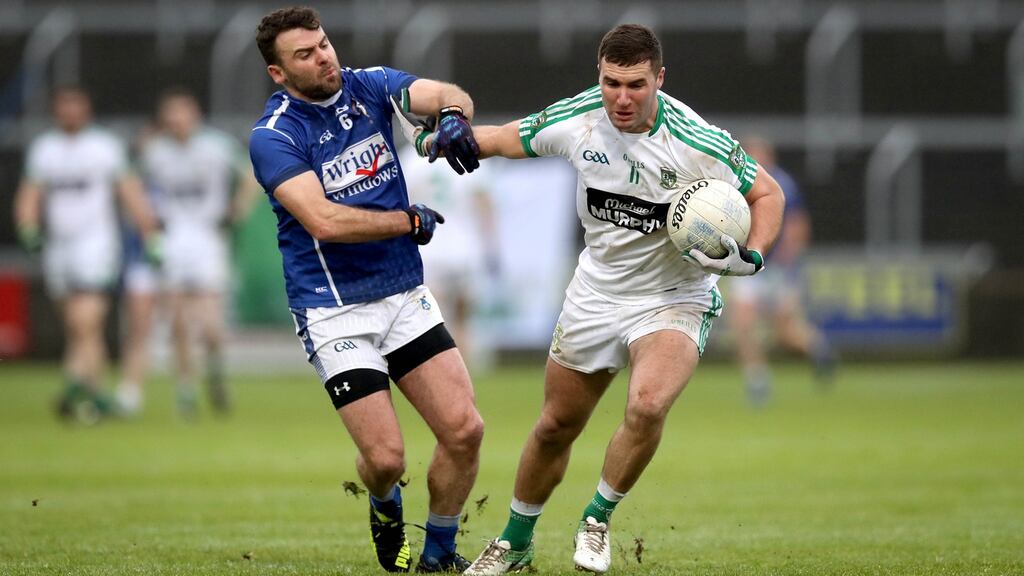 St. Loman’s Paddy Dowdall and Eddie Heavey of Moorefield during the Leinster senior football championship final. Photo: Ryan Byrne /Inpho