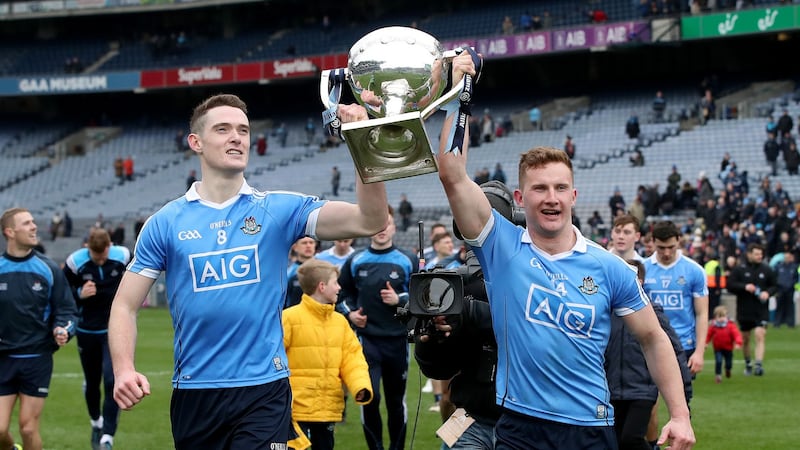 Dublin’s Brian Fenton and Ciarán Kilkenny celebrate with the Allianz Football League Division One trophy in Croke Park. Photograph: ©INPHO/Bryan Keane