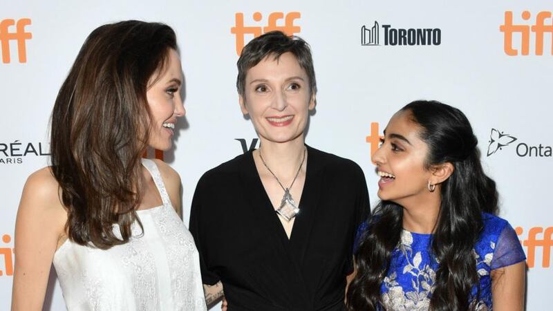 Hollywood backing: Nora Twomey with Angelina Jolie and Saara Chaudry, who provides the voice of Parvana, at Toronto International Film Festival. Photograph: George Pimentel/WireImage/Getty