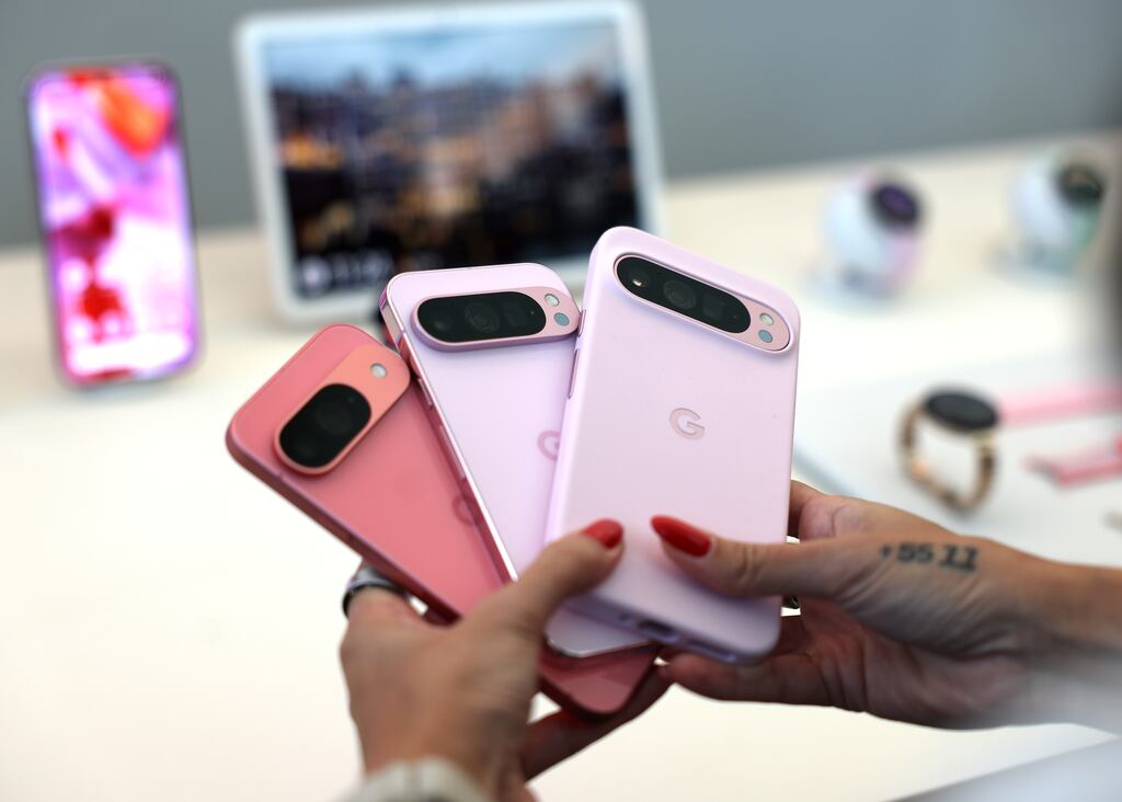 An attendee holds the new Google Pixel 9 phones during the Made By Google event at Google headquarters. Photograph: Getty