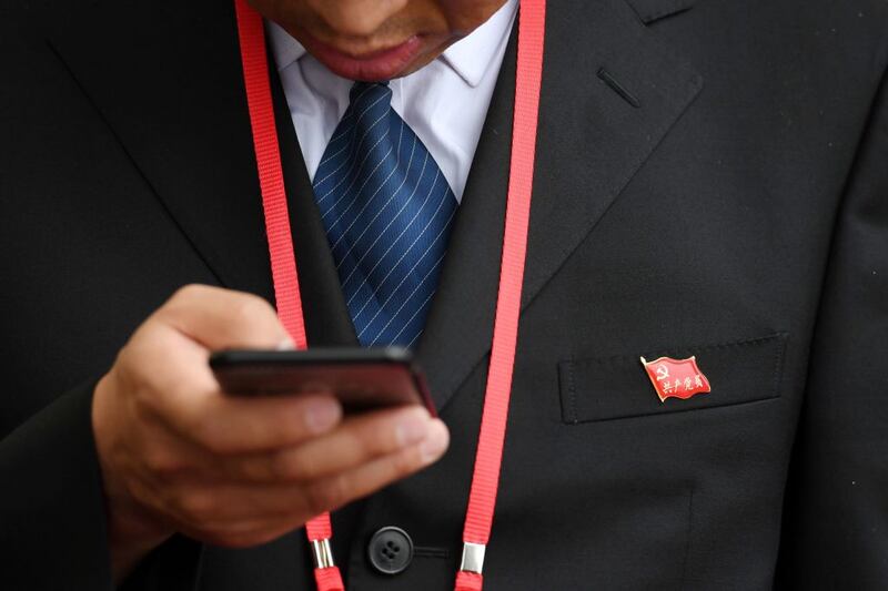 Most of China’s 97 million Communist Party members are supposed to wear their party pins at work, but observance is generally higher during politically sensitive times.  Photograph:  Greg Baker/AFP