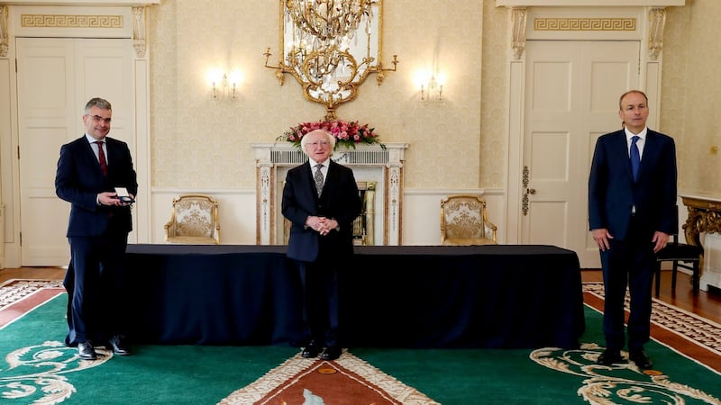 President Michael D Higgins presents the Minister for the Wesht Dara Calleary with his seal of office at Áras an Uachtaráin. Photograph: Maxwells
