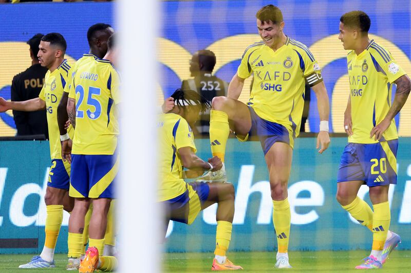 Cristiano Ronaldo celebrates a goal against Al-Riyadh with his Al-Nassr teammates. Photograph: Fayez Nureldine/AFP via Getty Images