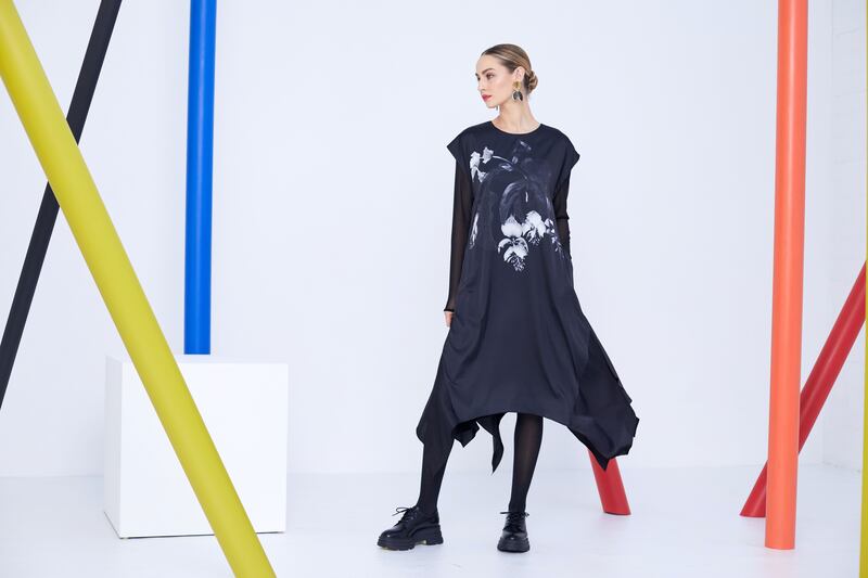 Mesh sleeve top €48, dipped hem placement print dress €210