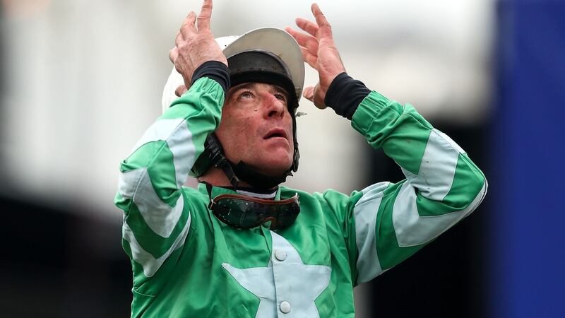 Davy Russell onboard Presenting Percy celebrates winning the RSA Insurance Novices’ Chase at Cheltenham. Photograph: James Crombie/Inpho