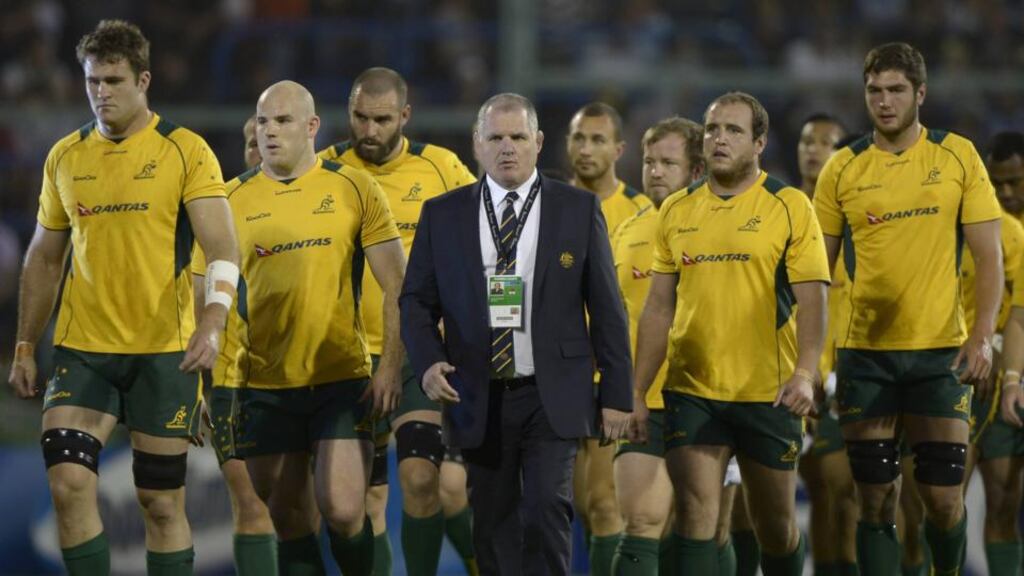 Australia’s Wallabies’ coach Ewen McKenzie walks next to players before the start of the Rugby Championship match against Argentina. Photograph: Juan Mabromata/AFP/Getty Images