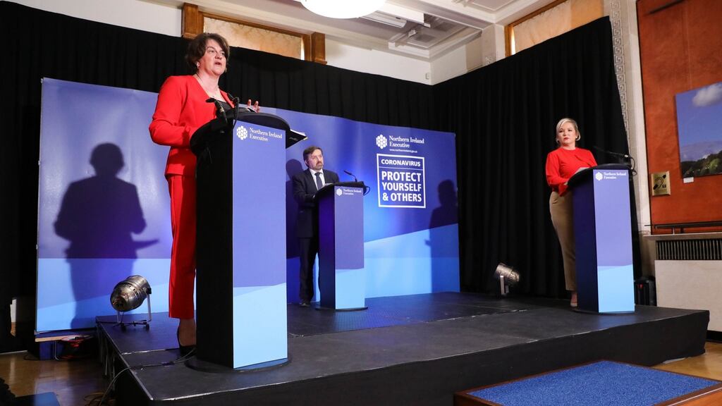 Northern Ireland’s first minister Arlene Foster, health minister Robin Swann and deputy first minister Michelle O’Neill during the daily media broadcast at Parliament Buildings in Stormont, Belfast. Photograph: Kelvin Boyes/Press Eye/PA Wire