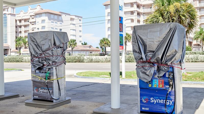 Pumps stand as no fuel is available at an Exxon Mobil Corp. gas station ahead of Hurricane Dorian in Melbourne, Florida on Sunday.  Photographer: Zack Wittman/Bloomberg