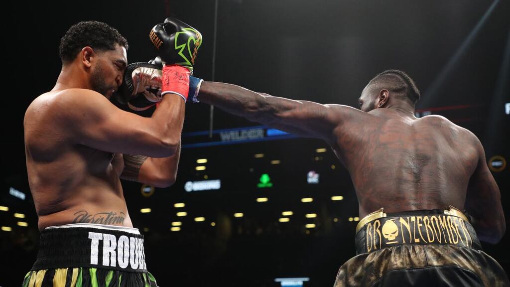 Deontay Wilder lands a straight left on Dominic Breazeale during their the WBC heavyweight title at Barclays Center on in New York City on Saturday night. Photograph: Al Bello/Getty Images