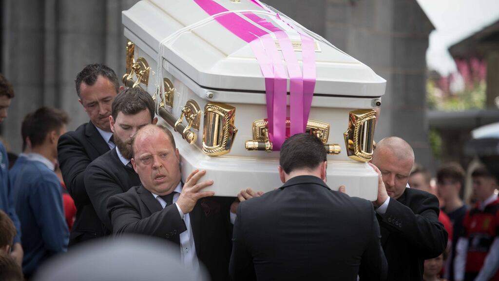 Bereft mourners shoulder the coffin for Shay Moloney’s final journey. Photograph: Eamon Ward