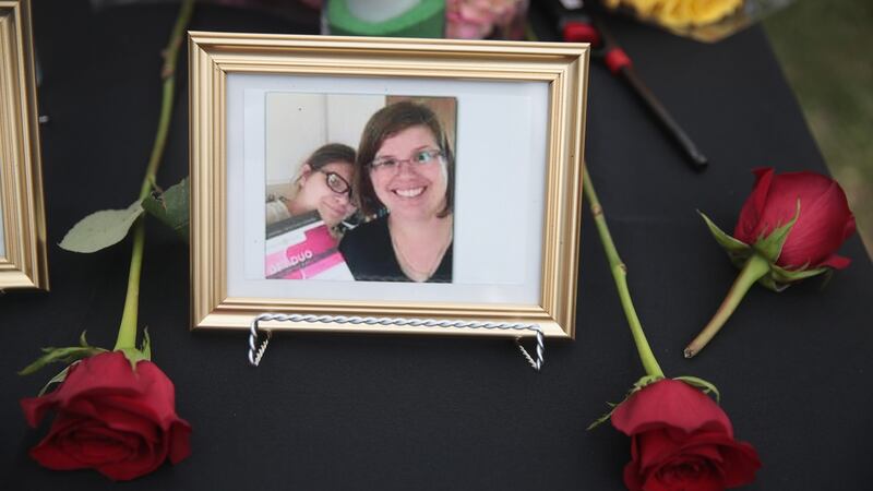 Photographs of victims of the Santa Fe high school shooting displayed during a prayer vigil at Walter Hall Park in League City, Texas on Sunday. Photograph: Scott Olson/Getty Images