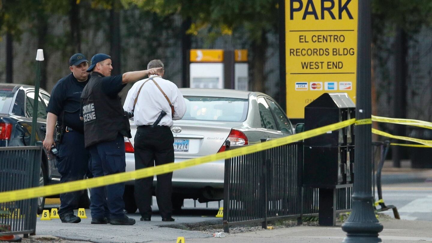 Crime scene investigators survey the area after a shooting in downtown Dallas, Friday, July 8th, 2016. Photograph: LM Otero/AP