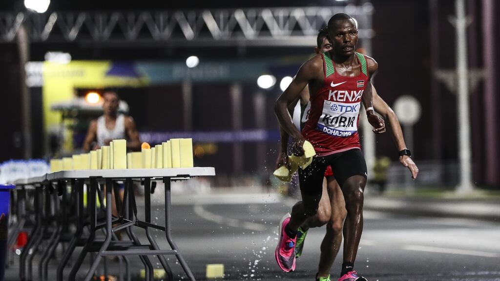 Laban Kipngetich Korir of Kenia splashes water during the marathon in Doha at the World Athletics Championships which was marred by serious heat. Photo: Maja Hitij/Getty Images