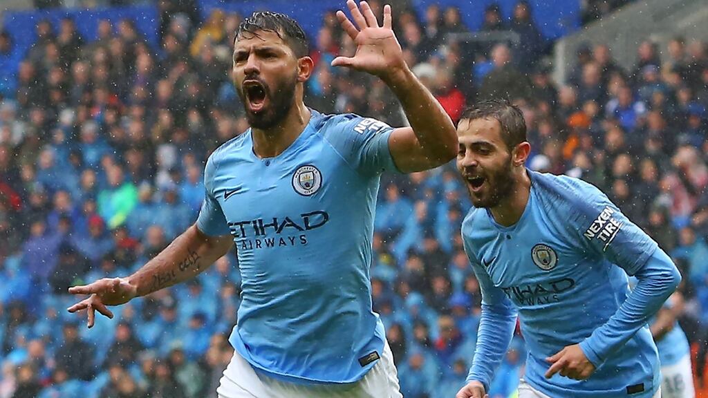 Manchester City striker Sergio Agüero celebrates after scoring the opening goal in the Premier League match against Cardiff City at Cardiff City Stadium. Photograph: Geoff Caddick/AFP/Getty Images