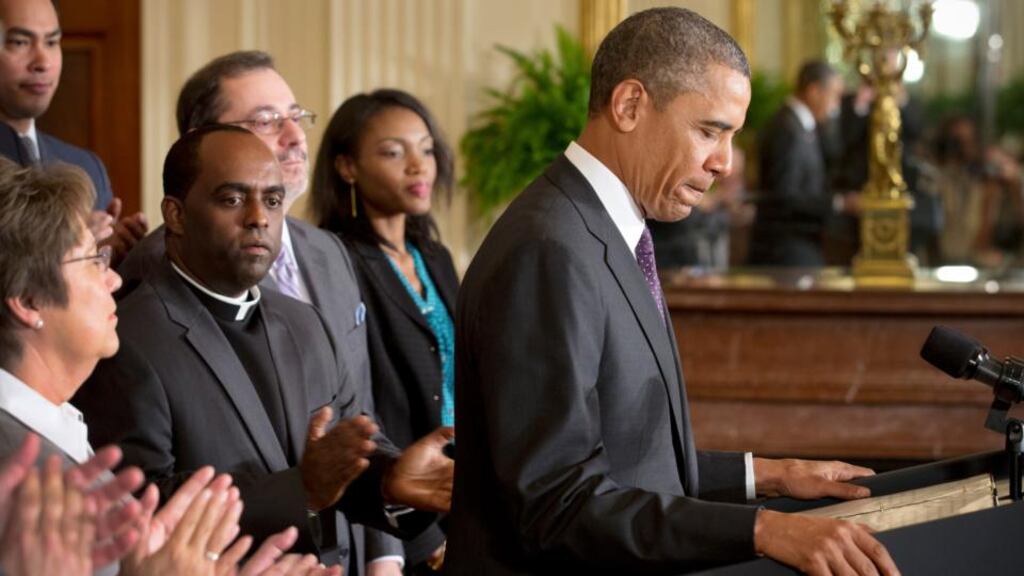 US president Barack Obama is surrounded by proponents of new immigration laws as he speaks at a news conference in the East Room of the White House, in Washington, last  Tuesday. Photograph: Stephen Crowley/New York Times