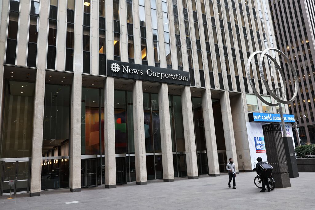 Rupert Murdoch's News Corporation will cut about 5% of its workforce globally. Photograph: Michael M. Santiago/Getty Images