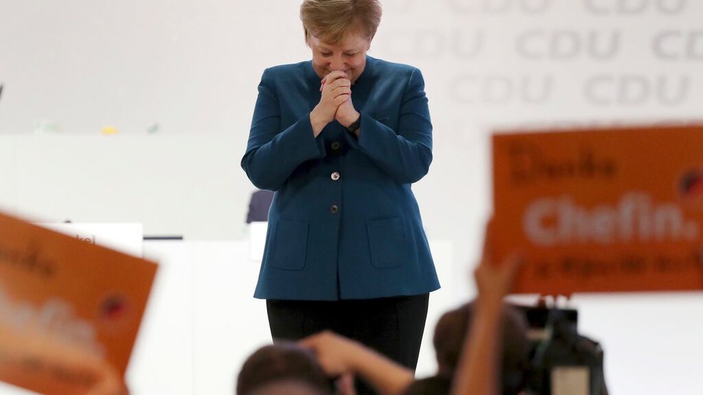 German chancellor and chairwoman of the Christian Democratic Union (CDU) Angela Merkel is applauded after her farewell speech. Photograph: Christian Charisius/DPA via AP