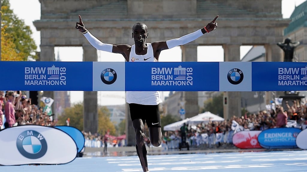 Eliud Kipchoge runs to win the 45th Berlin Marathon on Sunday. Kipchoge set a new world record in 2 hours 1 minute 39 seconds. Photo: Markus Schreiber/EPA