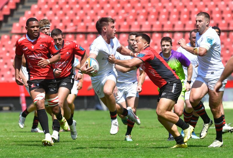 Ulster's Ethan McIlroy looks to offload during the United Rugby Championship match against Emirates Lions. Photograph: Sydney Seshibedi/Gallo Images