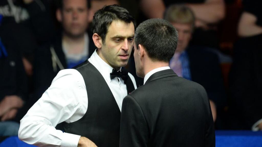Ronnie O’Sullivan is spoken to by referee Olivier Marteel in his second round match against Matthew Stevens during day nine of the Betfred World Championships at the Crucible Theatre. Photo: Anna Gowthorpe/PA