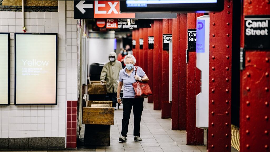 A commuter wears a protective mask in the Canal Street subway station in Chinatown neighborhood of New York, on Wednesday. Photograph: Nina Westervelt/Bloomberg