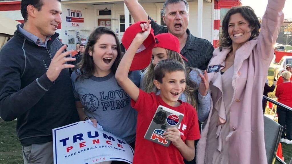 Leslie Rossi with her family outside The Trump House, the property she turned into a local campaign office for the candidate in western Pennsylvania, helping Trump become the first Republican to win the state since 1988