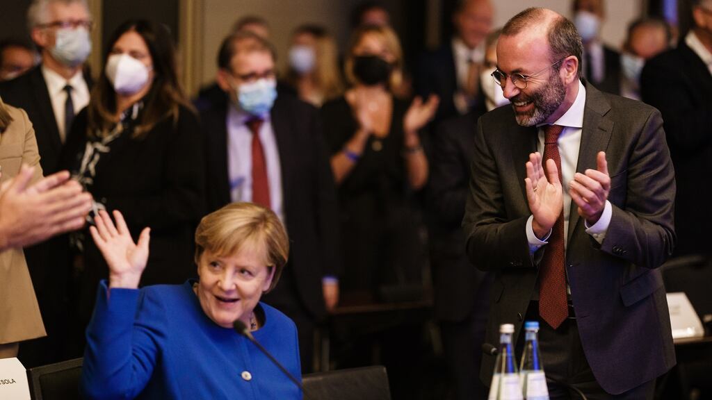 German chancellor Angela Merkel and European People’s Party chairman Manfred Weber at an EPP meeting in Berlin on Thursday. Photograph: Clemens Bilan