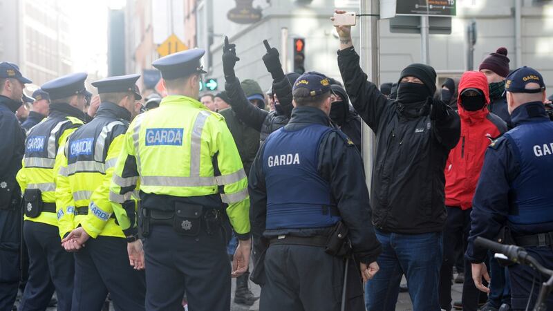 Gardaí form a line in front of counter-protesters against the ‘free speech’ demonstration. Photograph: Dara Mac Dónaill / The Irish Times