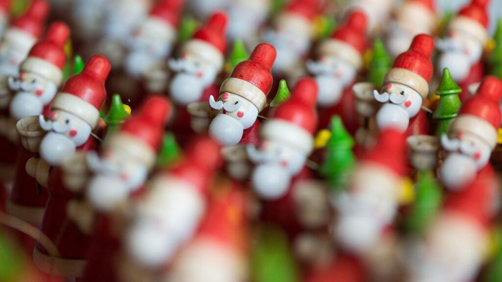 As a blushing Santa retreated to the brighter lights of the lounge, Vinny called for a refill. Photograph: Sebastian Kahnert/AFP/Getty Images