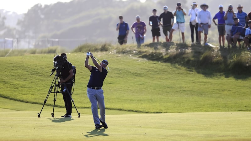 Mickelson hits his second shot at the 16th. Photo: Tannen Maury/EPA