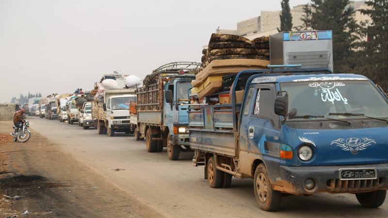 Trucks carry belongings of people fleeing from Maarat al-Numan, in northern Idlib, Syria. Photograph: Reuters