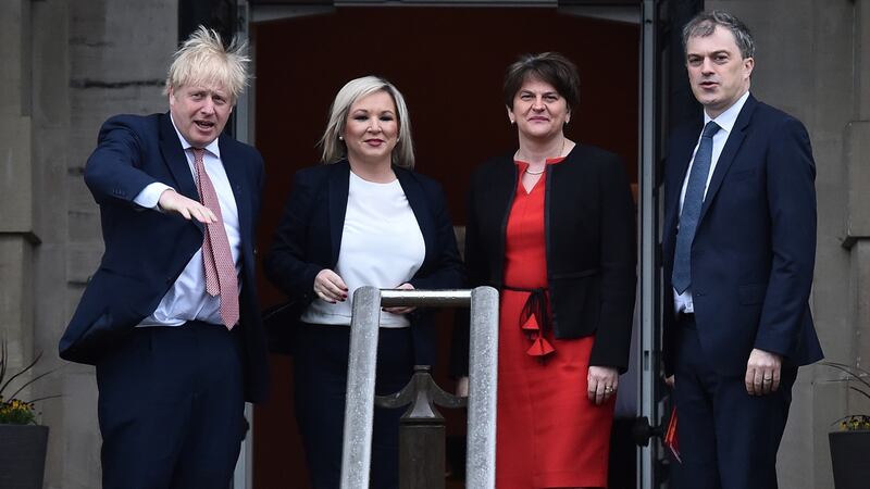 British prime Minister Boris Johnson and Secretary of State for Northern Ireland, Julian Smith are greeted by First Minister, Arlene Foster of the DUP and Deputy First Minister Michelle O’Neill  of Sinn Féin at Stormont. Photograph: Charles McQuillan/Getty