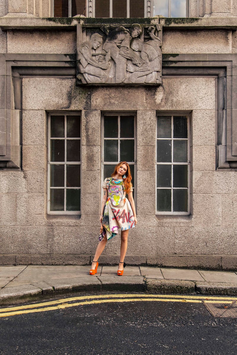 Spray painted canvas shift dress €150 and corset €175 both by Rioncarnation, hand painted earrings €75 by Kiki Na Art, acrylic and brass necklace €62 by A Little Idea, chrome and brass charm bracelets €24 each by McGonigle Glass Studio, silver plated charm bracelets €15 each by Nordic Root, vintage wedge heels €45 by Om Diva. Photograph: Mark Hill