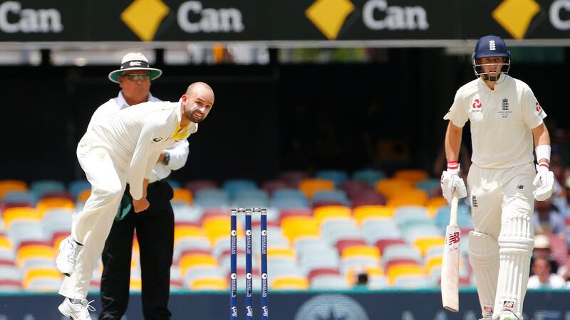 Nathan Lyon bowls during day four at the Gabba. Photograph: Jason O’Brien/PA