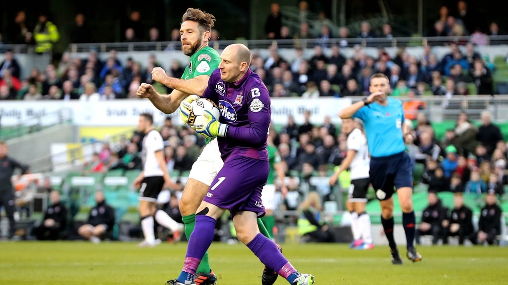 Dundalk’s Gary Rogers and Alan Bennett of Cork City clash in Sunday’s FAI Cup final. Photograph: Ryan Byrne/Inpho