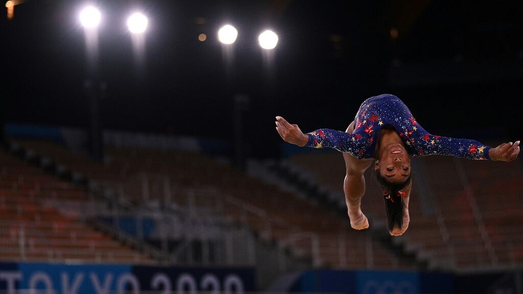 USA’s Simone Biles competes in the floor event of the artistic gymnastic women’s qualification during the Tokyo 2020 Olympic Games. Photo: Martin Bureau/AFP via Getty Images
