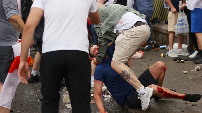 Two fans fighting outside the Webley stadium before the Euro 2020 final between Italy and England. Photograph: Getty