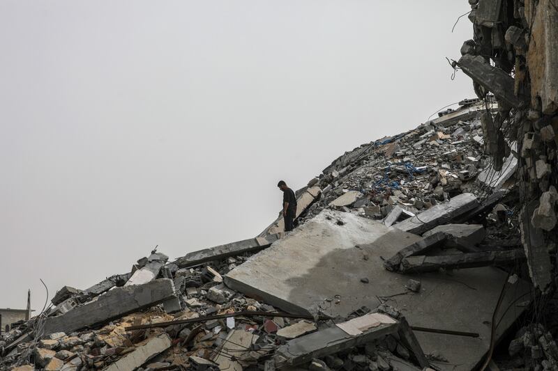 A Palestinian man stands in the rubble of a house in Gaza after returning to Al Nusairat refugee camp following the Israeli army's withdrawal. Photograph: Mohammed Saber